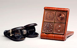 Opera glasses and travel clock owned by Milton S. Hershey